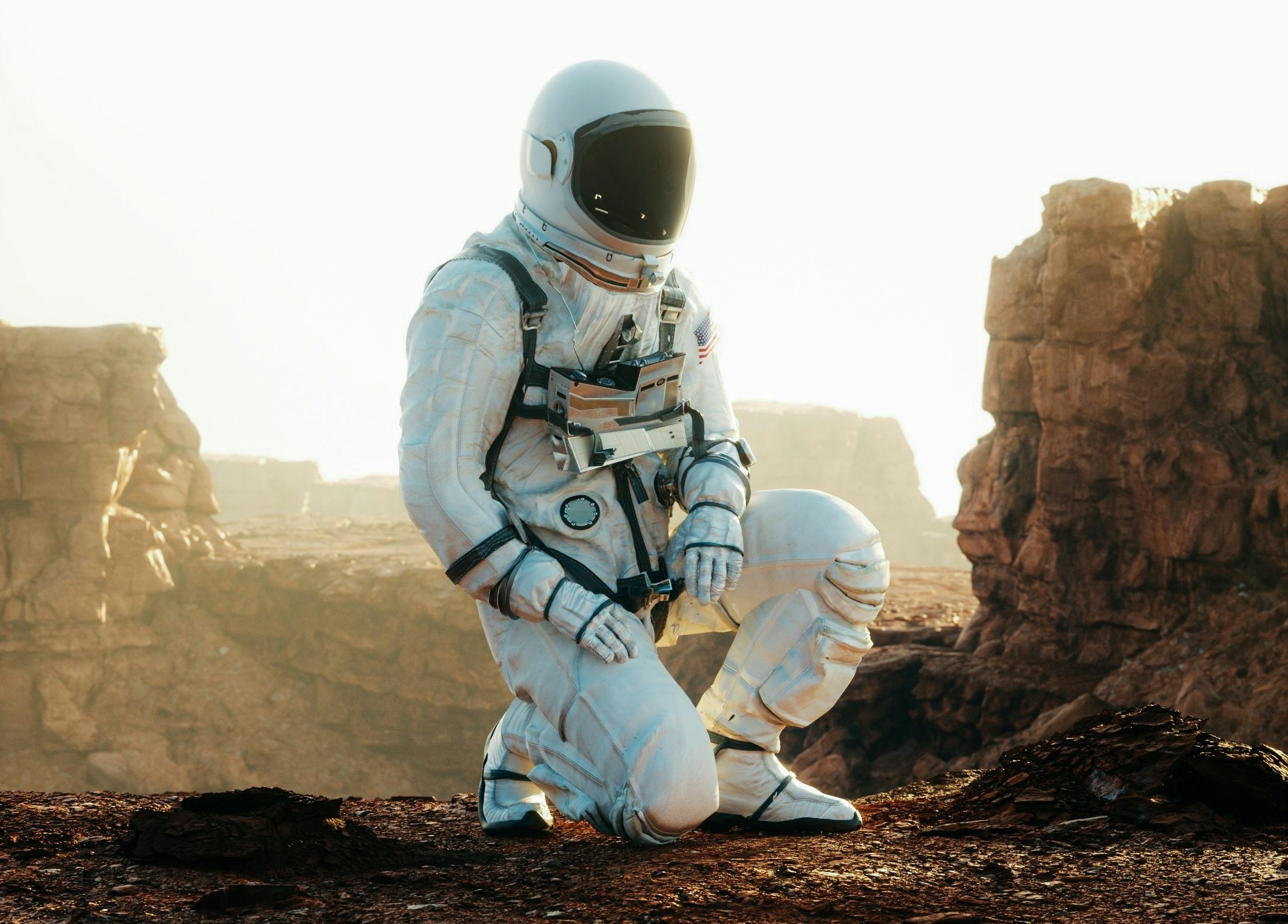 Astronaut on a knee inspecting new planet